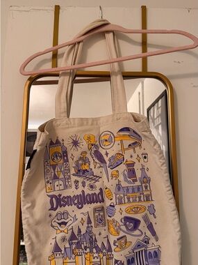 Disneyland Canvas Tote Bag in Cream with Purple & Gold Print